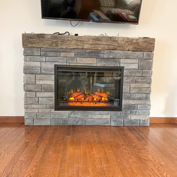 Electric stone fireplace in living room.